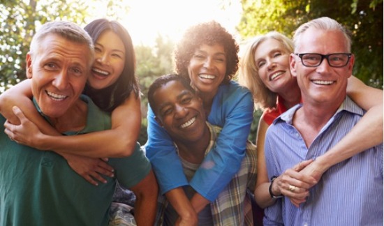 Group of older couples smiling.