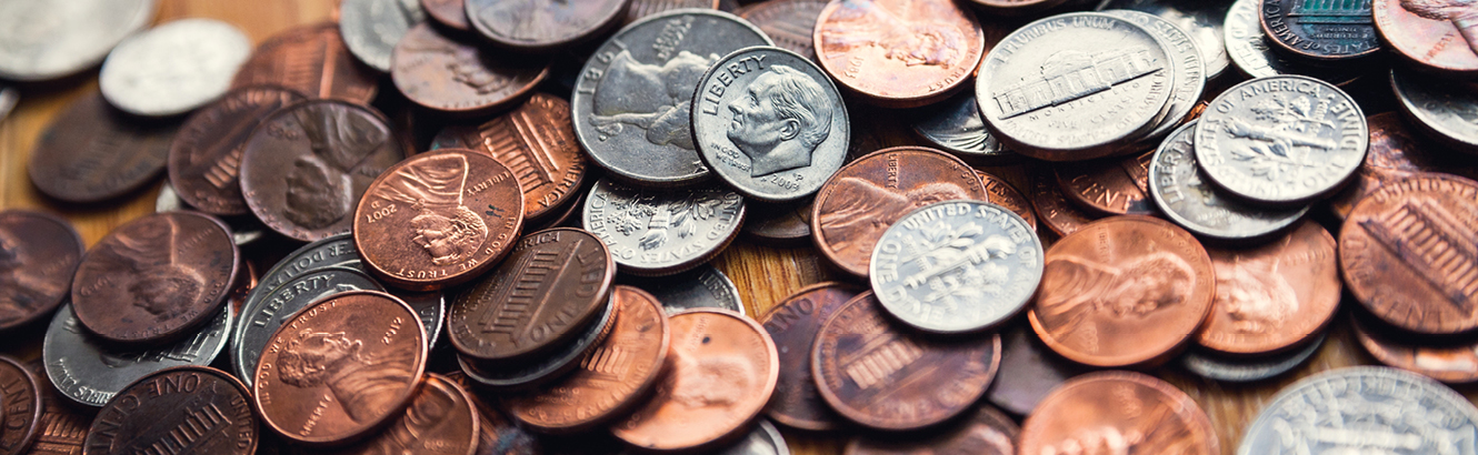 Coins scattered on a table.